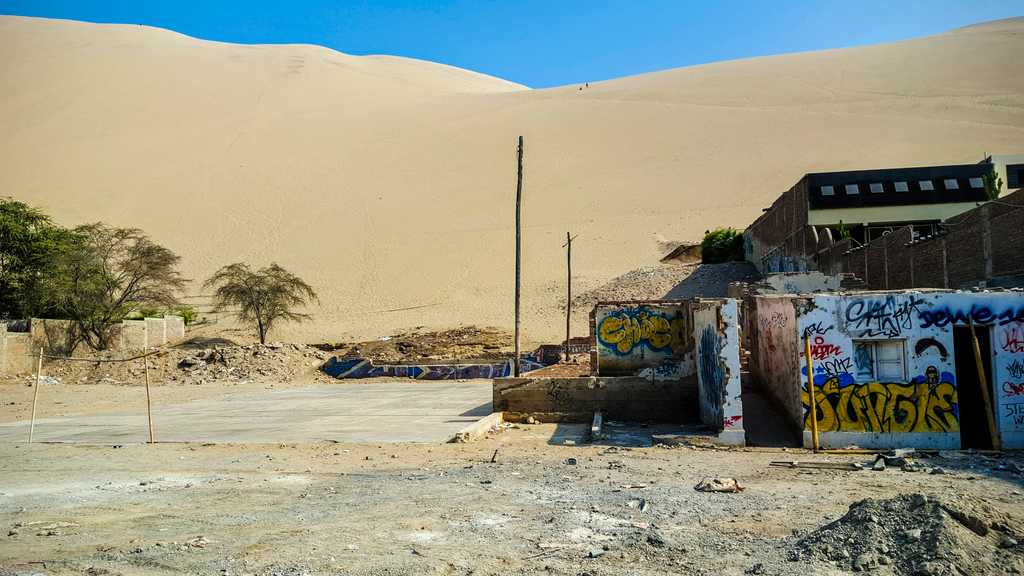 Soccer. The dunes seem to want to engulf the village