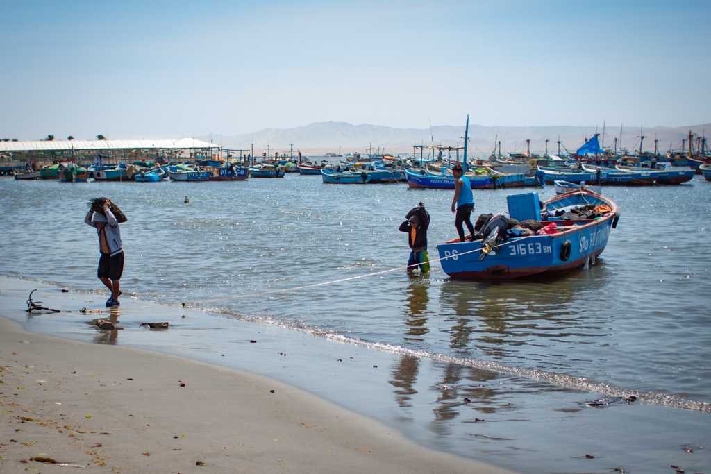 The swimming beach is surrounded by fishing and tour boats